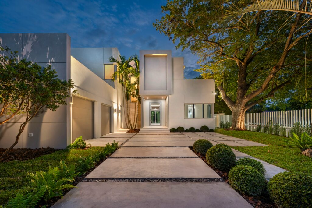 Modern luxury home entrance at twilight